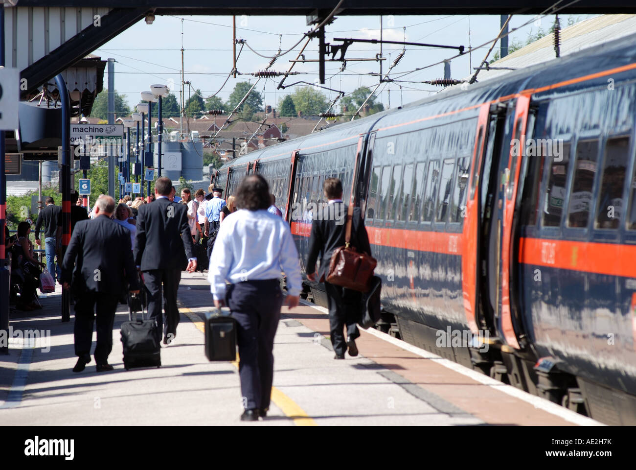 Businessmen getting off GNER Intercity 225 train at Grantham station, Lincolnshire, England, UK Stock Photo
