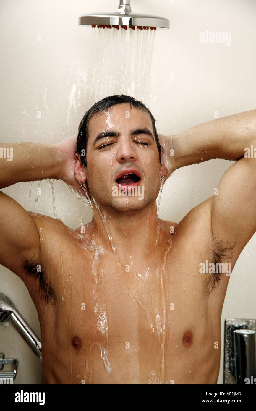 Man taking a shower at the gym Stock Photo Alamy