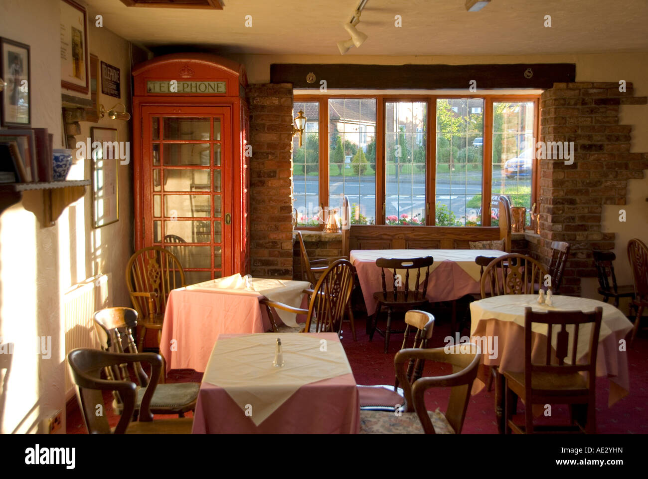 A Traditional British Red Telephone Box Inside A Cafe Or Tea Room Stock Photo Alamy