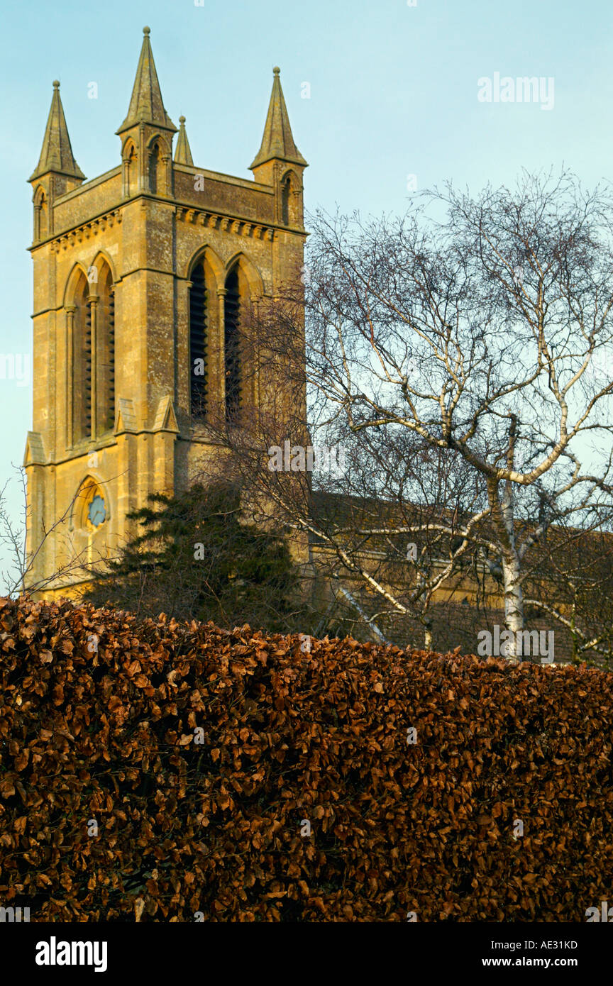 Church tower and hedgerow, Broadway, England Stock Photo