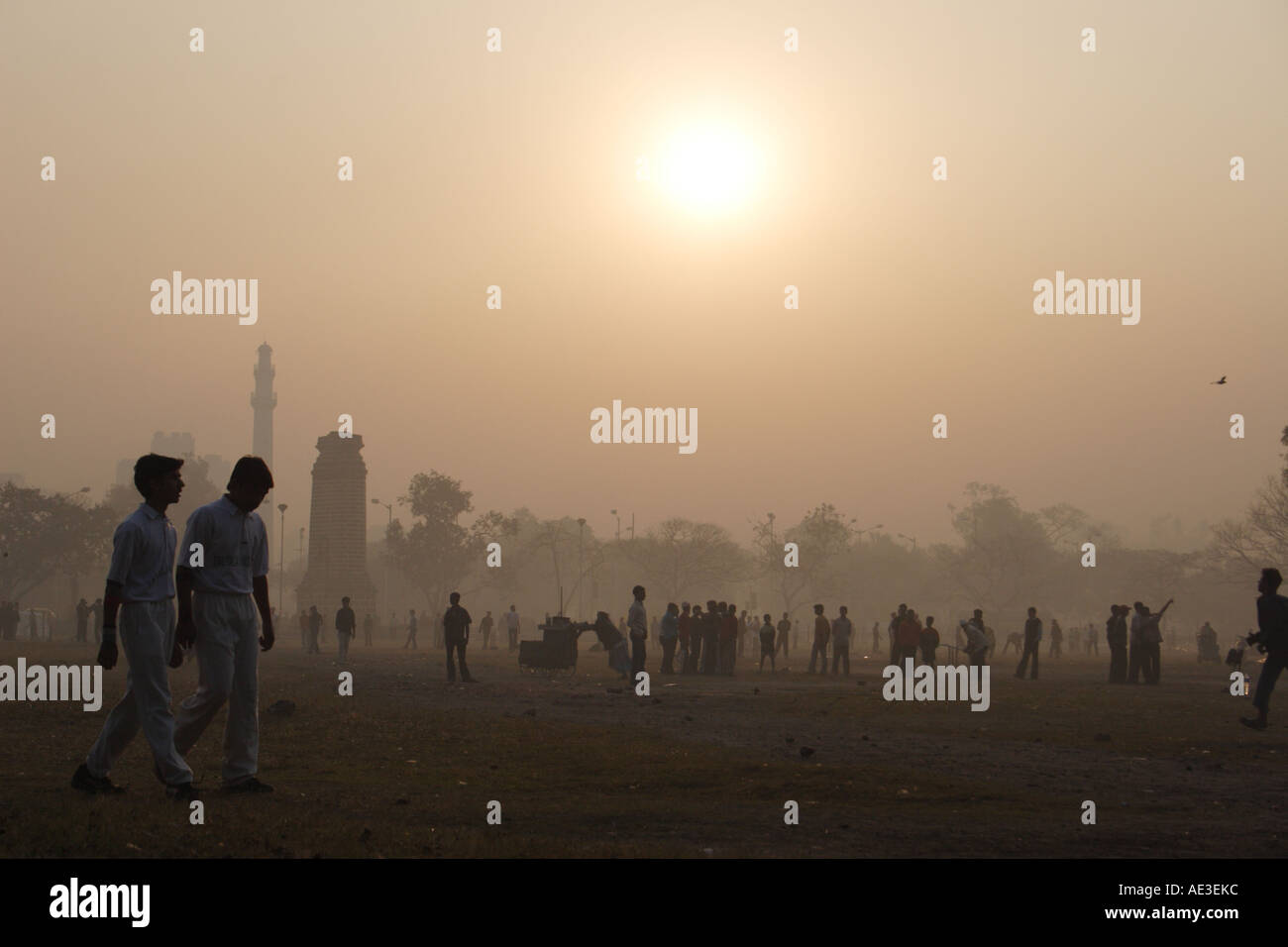 Young cricketers prepare for practice at dawn in India Stock Photo