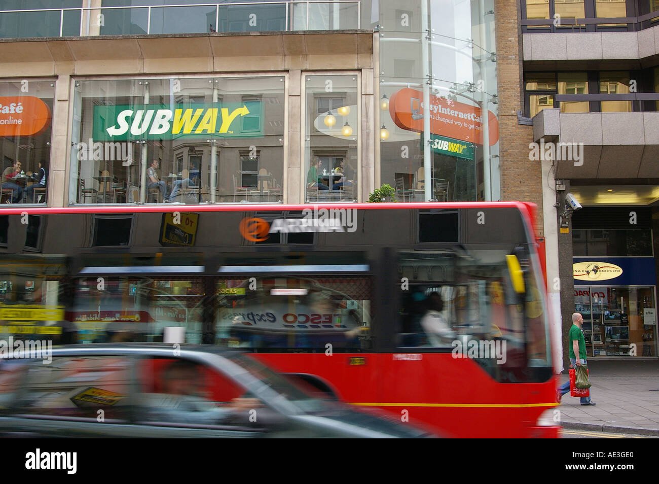 London traffic life red bus congested Tottenham court road shops Stock Photo