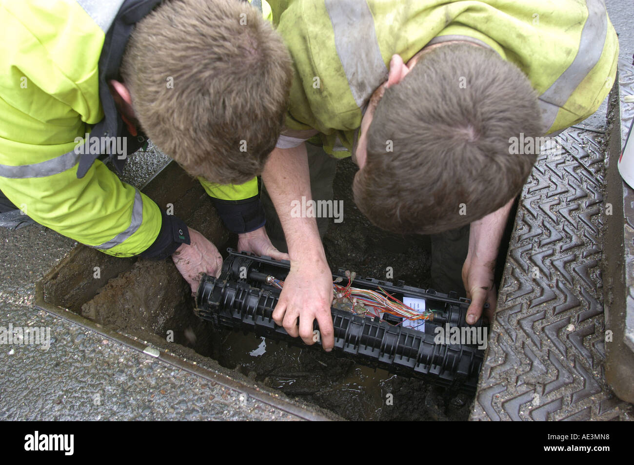 Engineers reparing cables for British Telecoms in Bovey Tracey Devon England Stock Photo