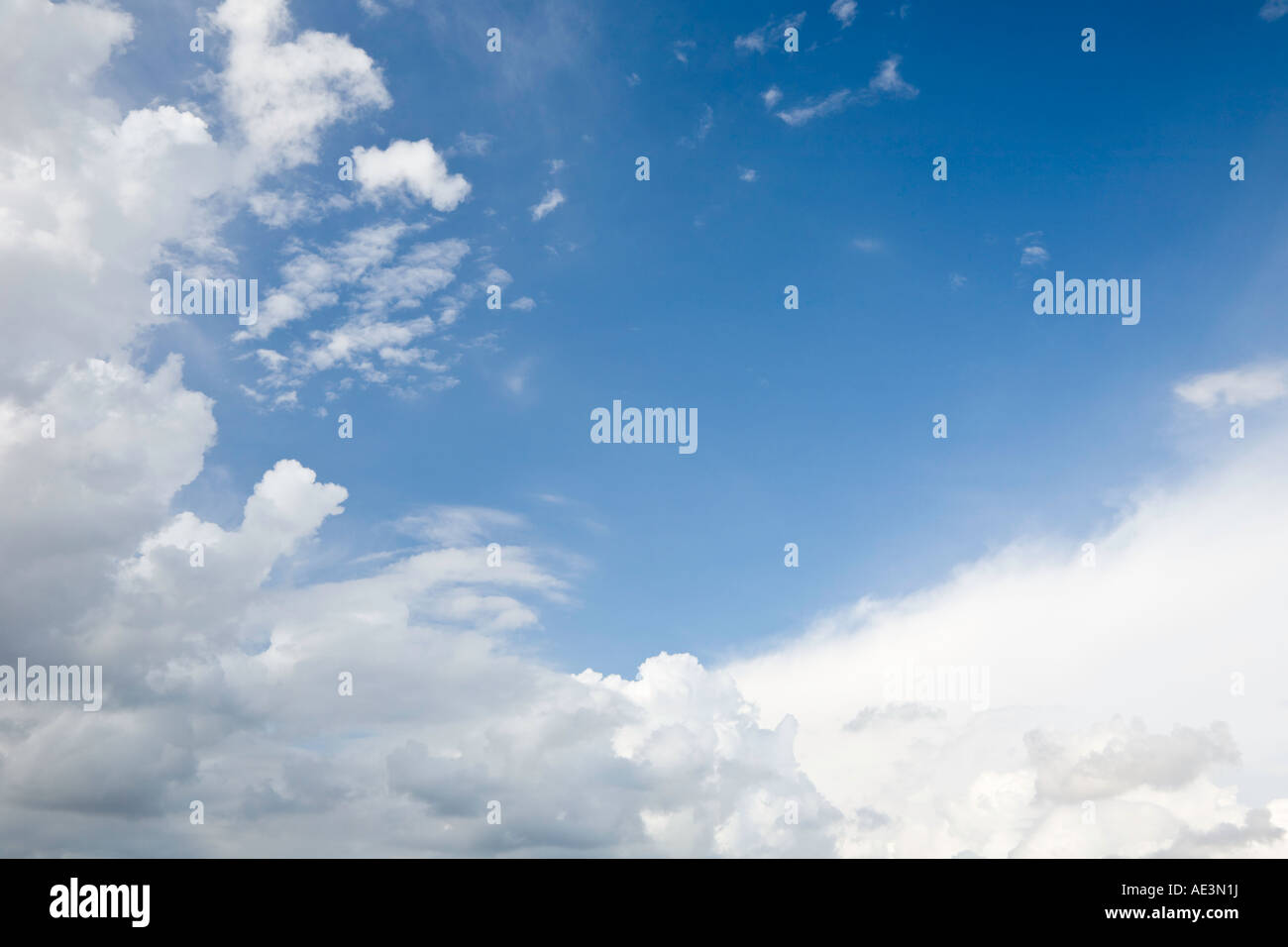 White cloud formations in a blue sky Stock Photo