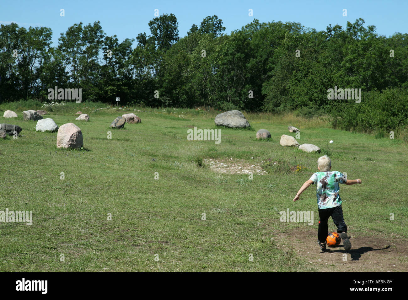 Playing football golf by kicking a football around an 18 hole course with different kinds of obstacles Stock Photo