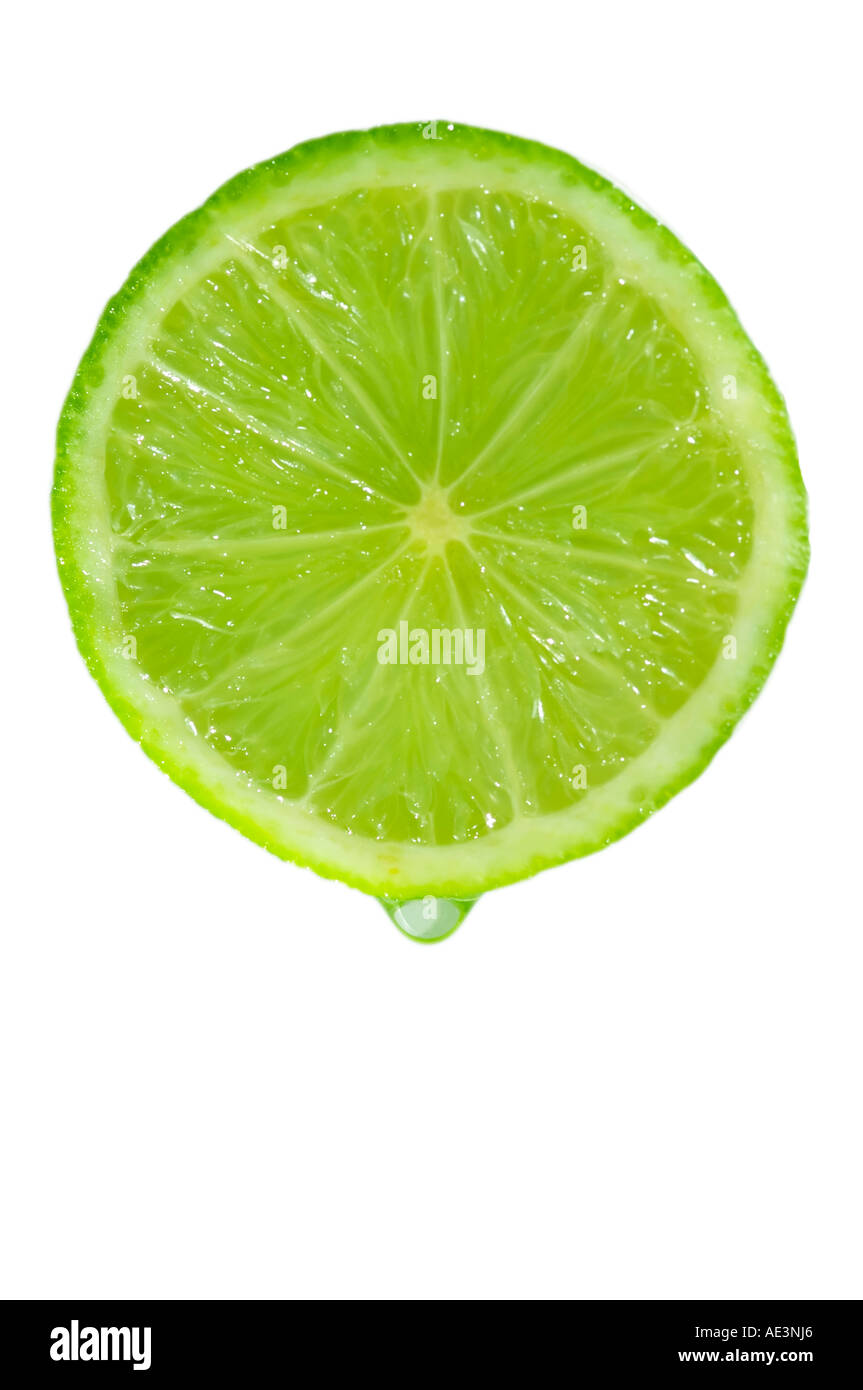 Drop of lime juice leaving a lime Stock Photo Alamy