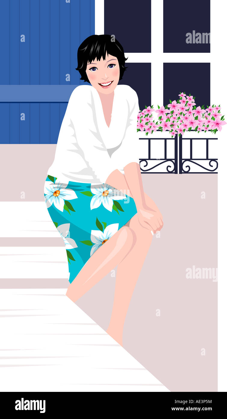 Portrait of a woman sitting and smiling Stock Photo - Alamy