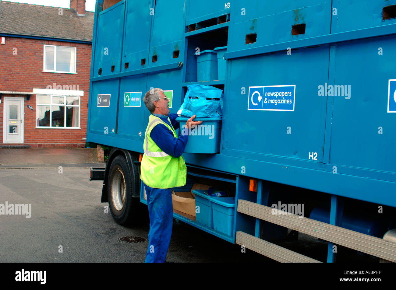 Council Worker Collecting Rubbish For Recycling. Stock Photo