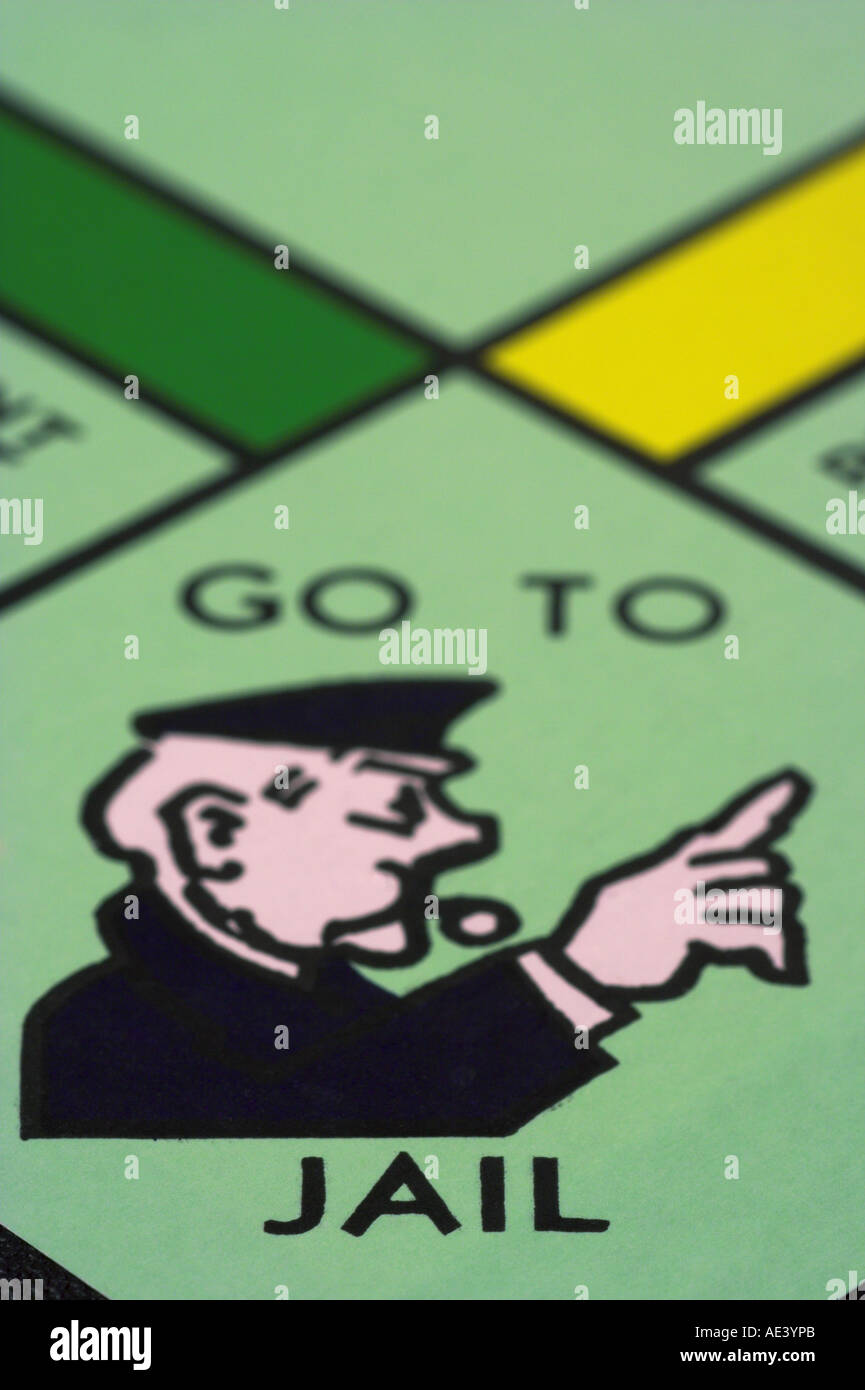vertical photo of monopoly game board showing go to jail square Stock