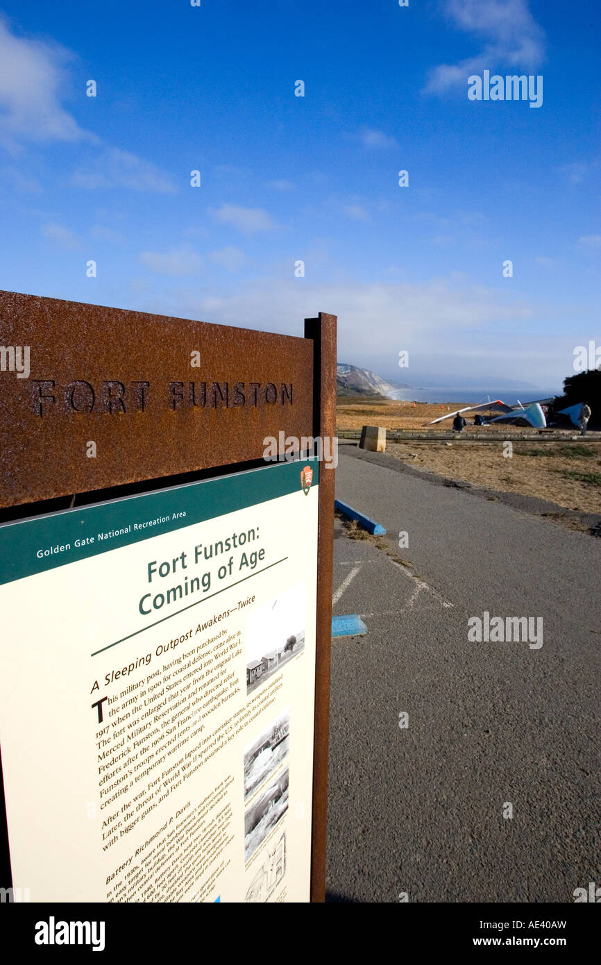 Fort Funston sign with hang gliders and the California coastline in the background Stock Photo
