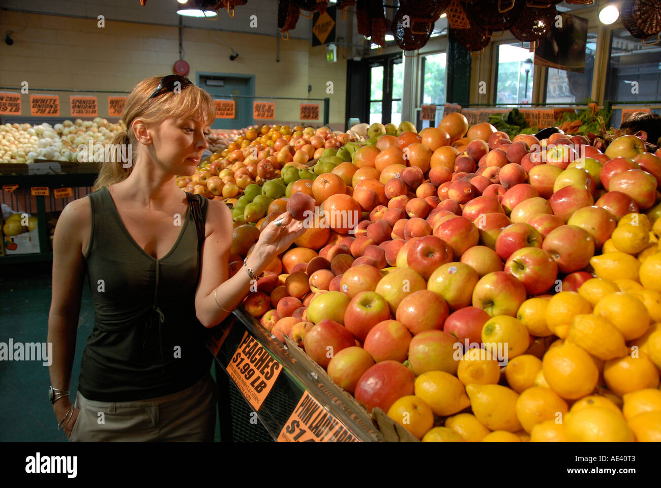 Reading Terminal Market woman buying produce Philadelphia Pennsylvania