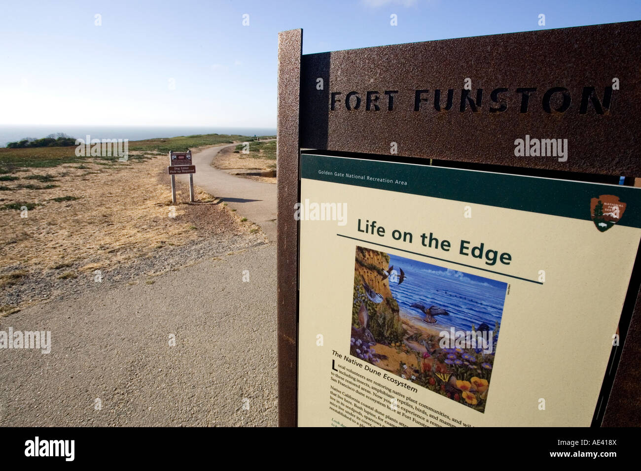 Fort Funston sign with hang gliders and the California coastline in the background Stock Photo
