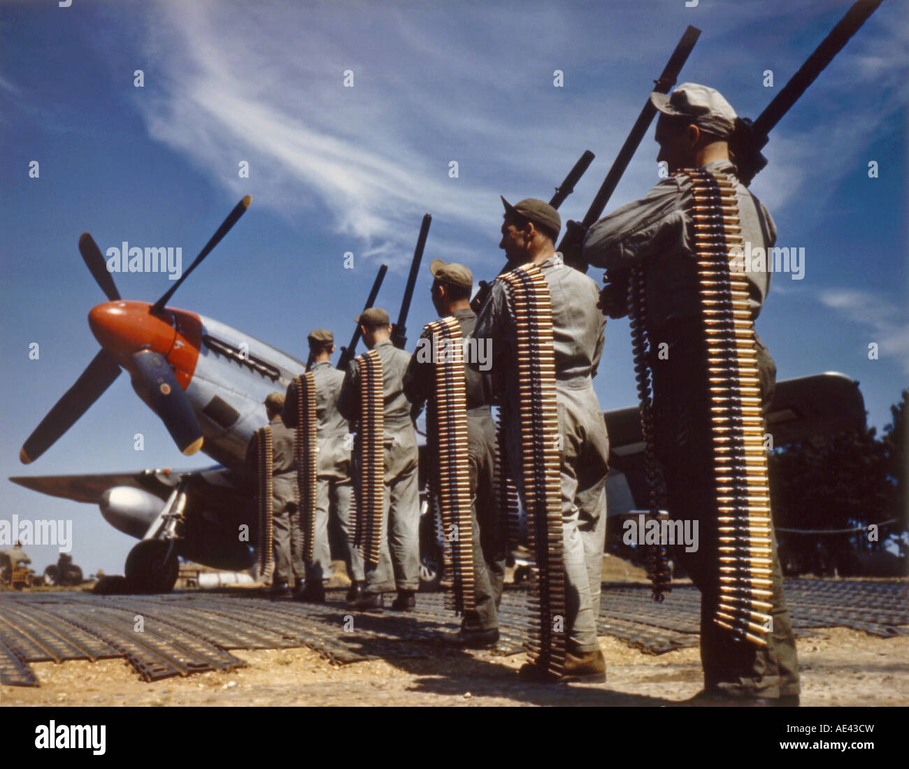 World War Two ground crew loading a P 51D Mustang fighter Stock Photo