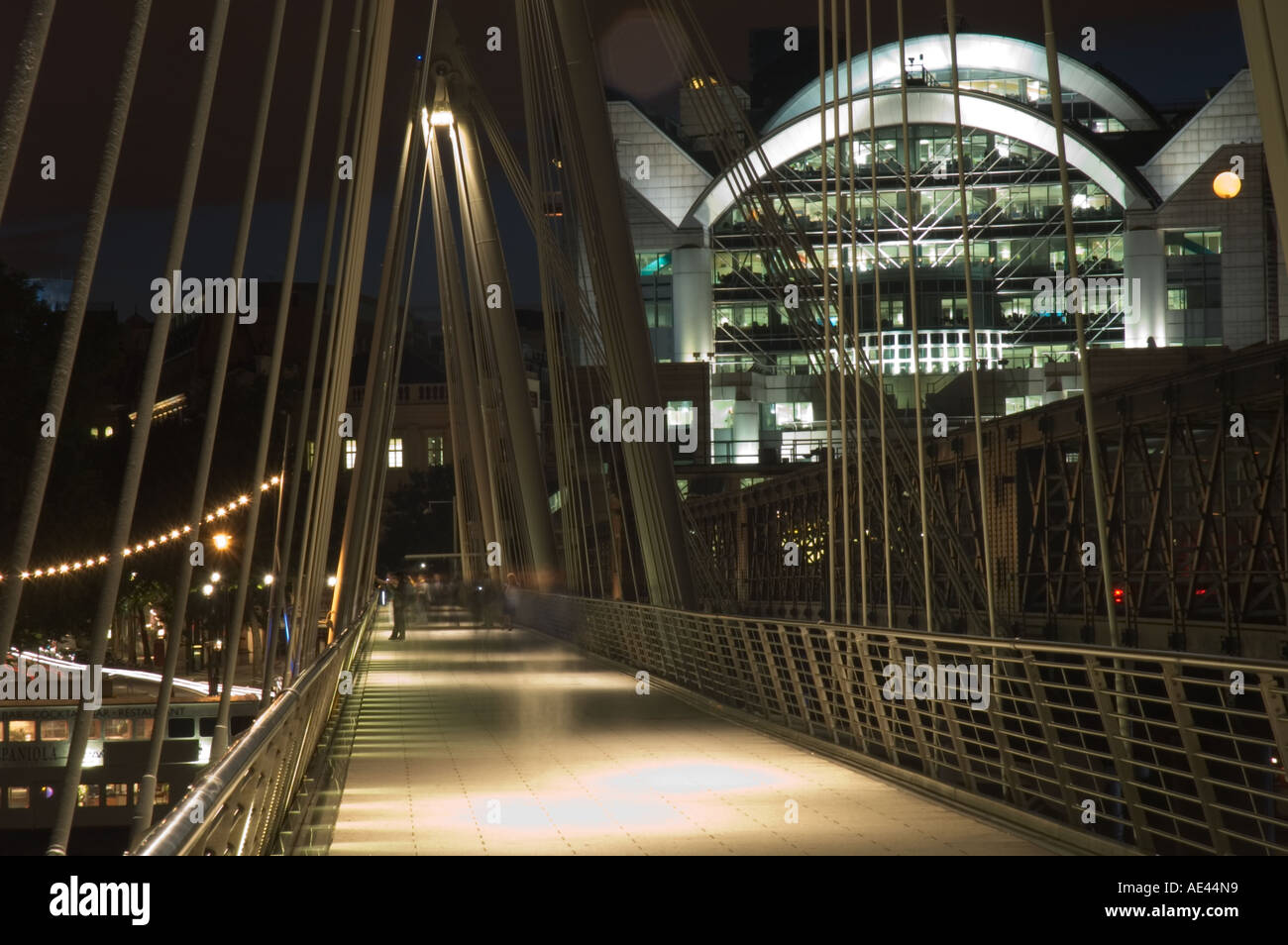 Golden Jubilee Bridge (aka Hungerford Bridge) and Charing Cross Railway Station (Embankment Place), Westminster, London, England Stock Photo