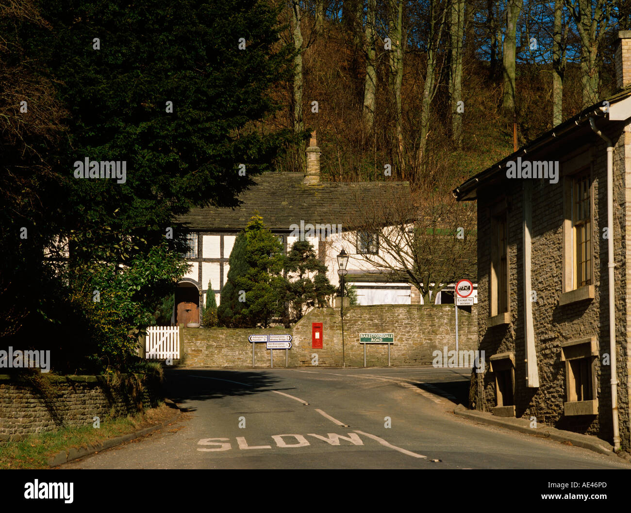 UK Cheshire Pott Shrigley village with post box set into wall at junction Stock Photo