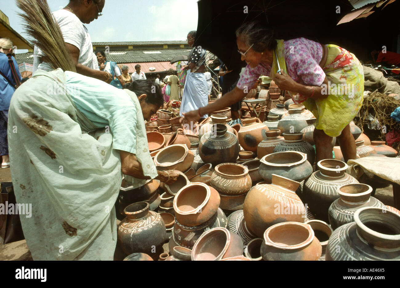 India Goa Mapusa market crafts people buying pots Stock Photo