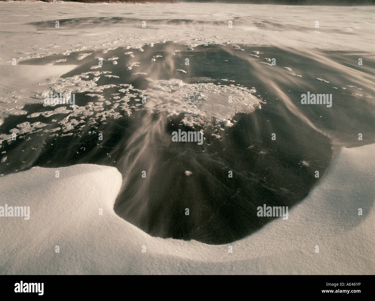 Ice and blowing snow on Lake Myosotis, Rensselaerville, New York State, United States of America Stock Photo