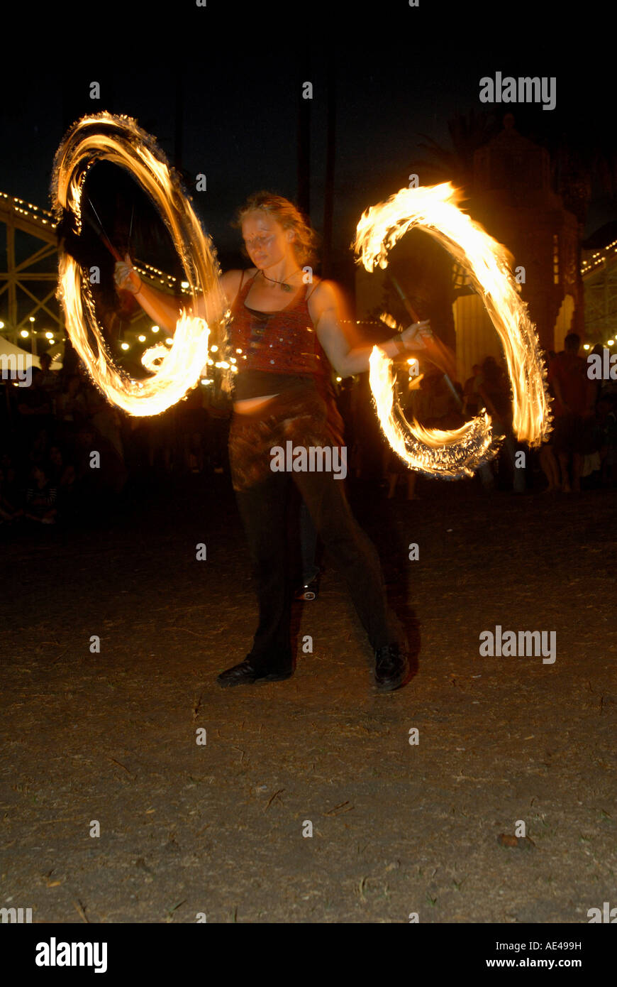 Juggler twirling rods during her performance, O’Donnell Gardens, suburb of St. Kilda, Melbourne, Victoria, Australia, Pacific Stock Photo