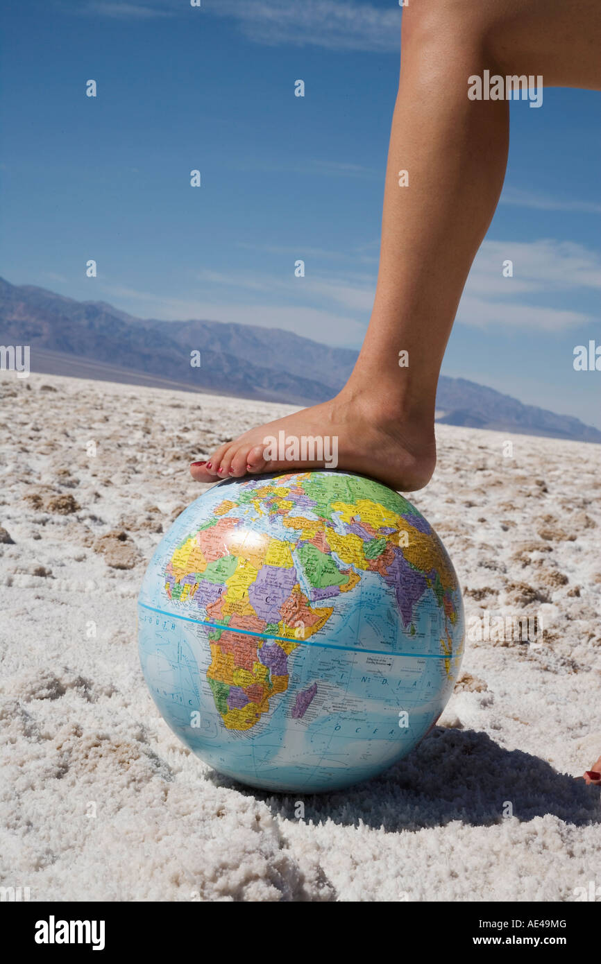 Woman's foot on globe, Bad Waters Point, Death Valley National Park,  California, United States of America Stock Photo - Alamy