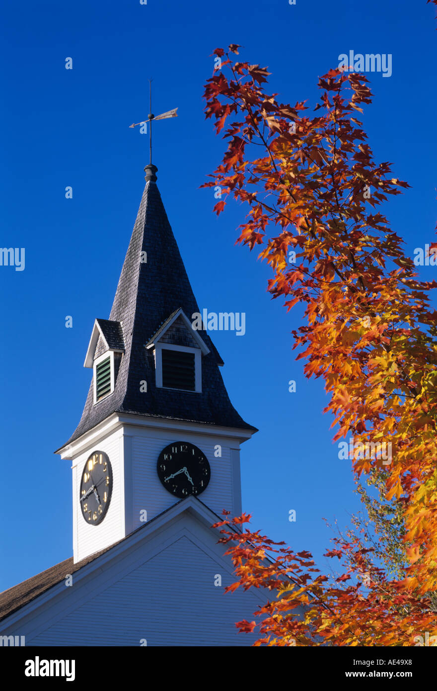 USA, New England, Church and Maple in the fall. Sugar Hill, New Hampshire Stock Photo