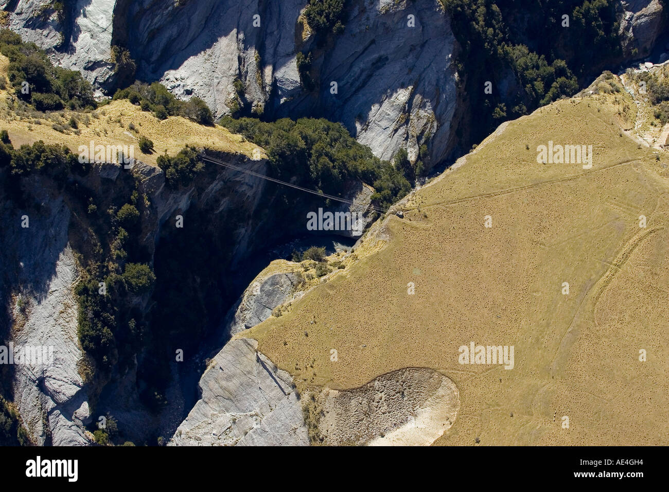 Pipeline across Stony Creek gorge near Skippers Canyon near Queenstown South Island New Zealand aerial Stock Photo