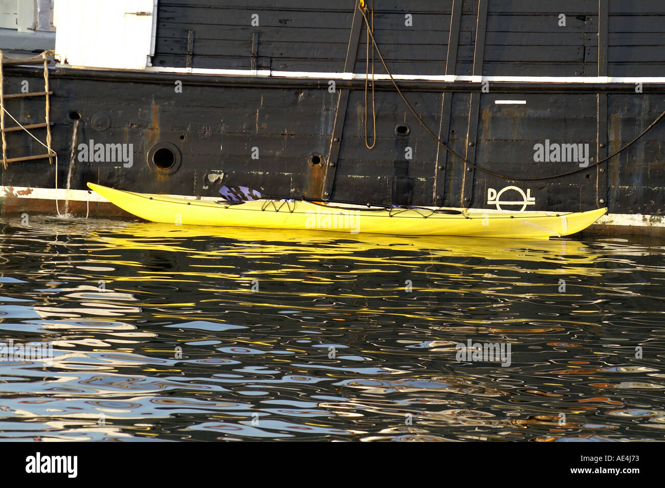 small kanu on big boat Stock Photo