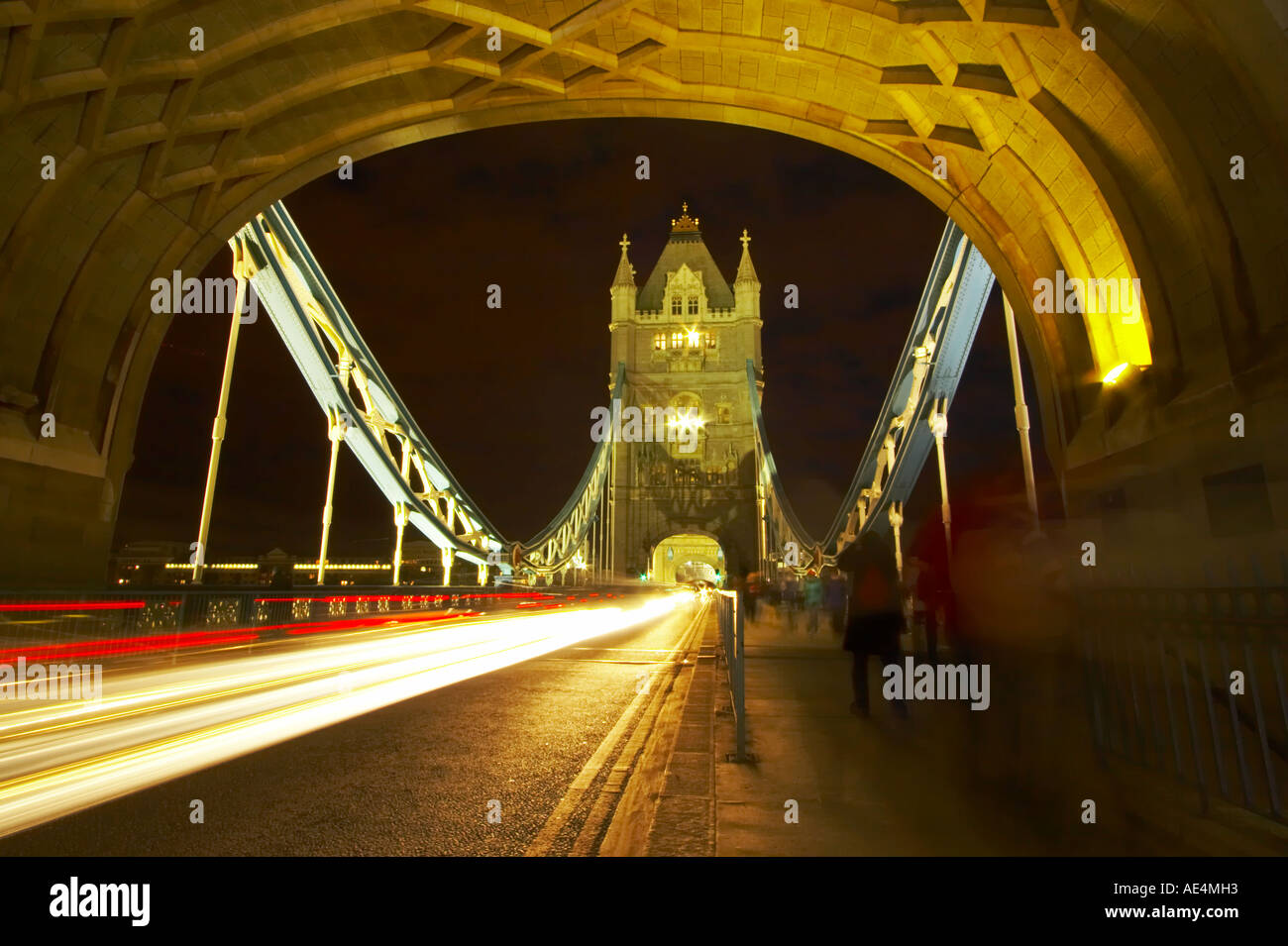 Traffic trails through Tower Bridge, London, at night Stock Photo