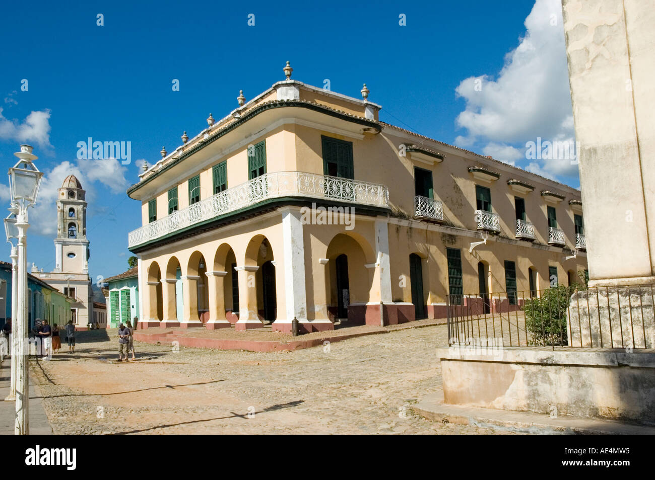 The Palacio Brunet, now the Museo Romantico, is a two-storey mansion in warm yellow stucco on Plaza Mayor in Trinidad de Cuba. Stock Photo