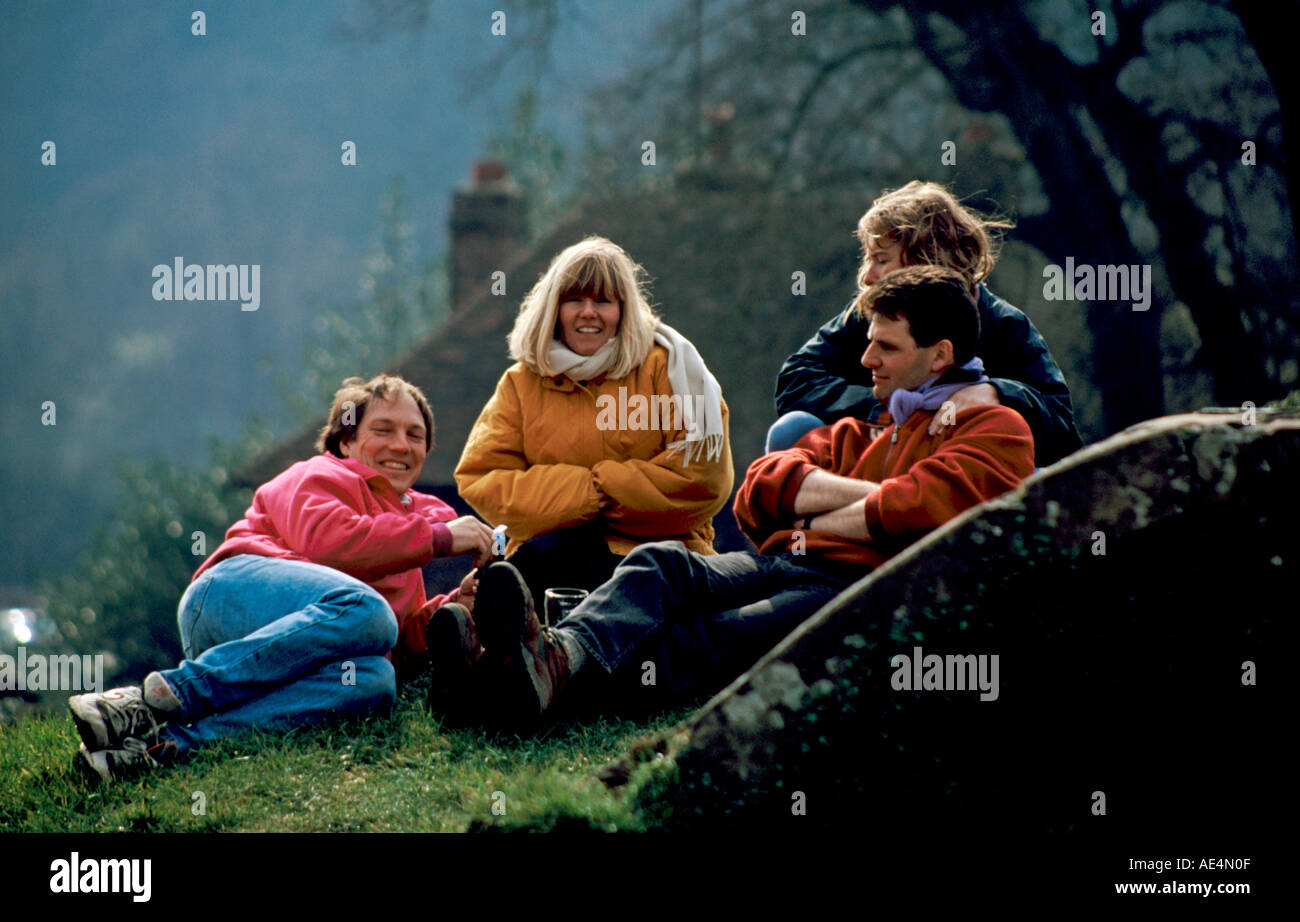 Four people enjoying the outdoors in warm clothing Surrey England Stock Photo