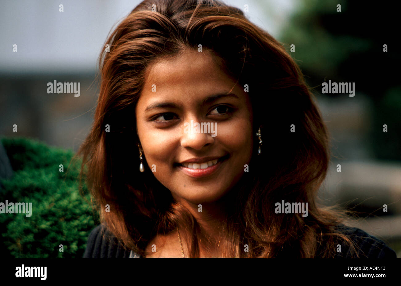Mixed race woman smiling hi-res stock photography and images - Alamy