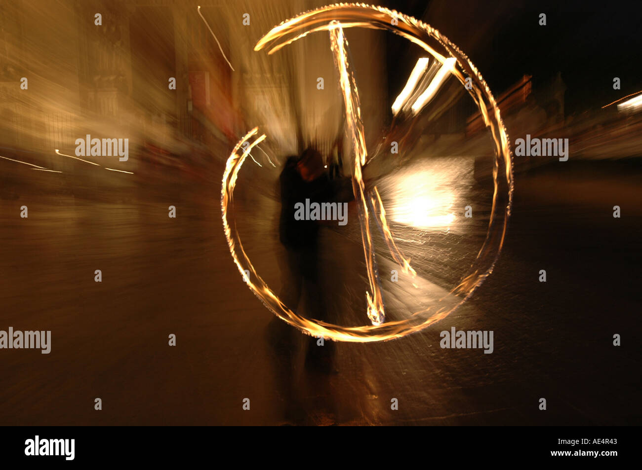 Creative D image of a street entertainer throwing fire chains near the ...