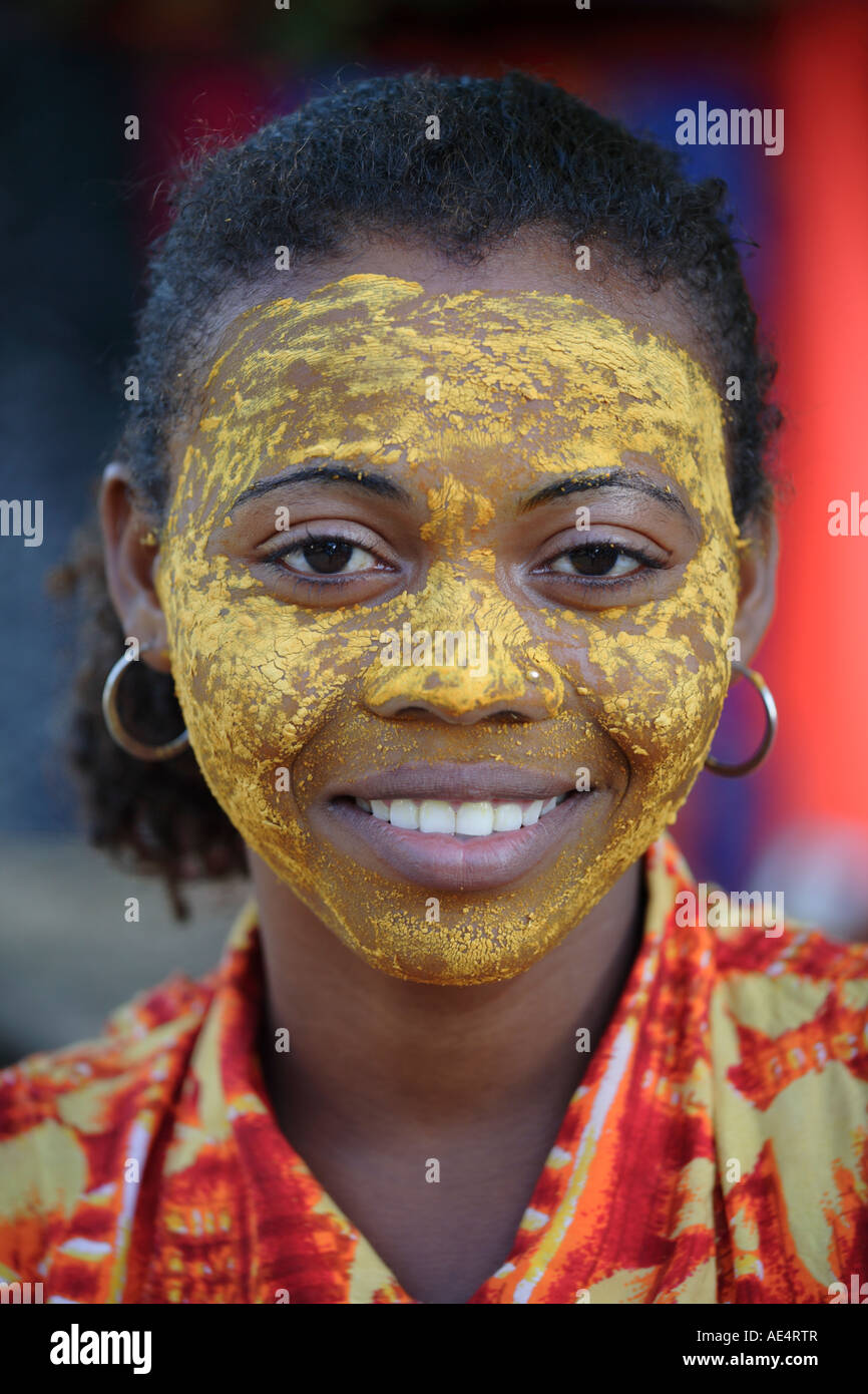Many Malagasy women paint their faces with crushed roots or bark of selected trees to protect against the sun, Madagascar Stock Photo