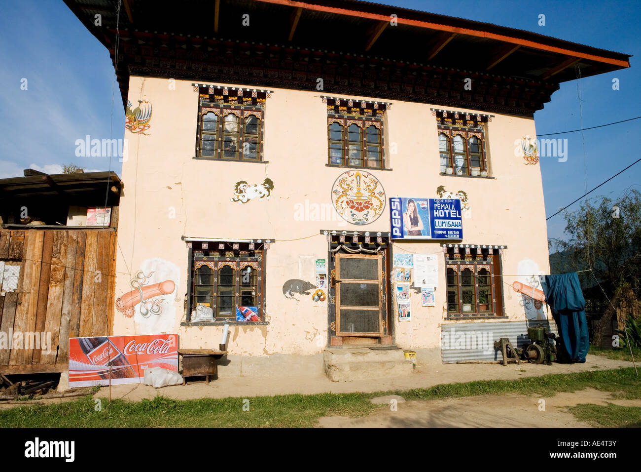 Restaurant on the road between Paro and Punakha, the phallus on the wall is a religious symbol to ward off evil spirits, Bhutan Stock Photo