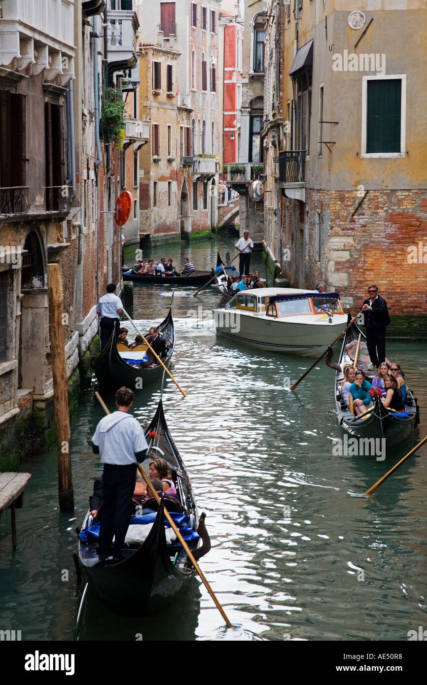 Gondolas on one of the many canals with typical Venusian architecture in Venice Italy Stock Photo