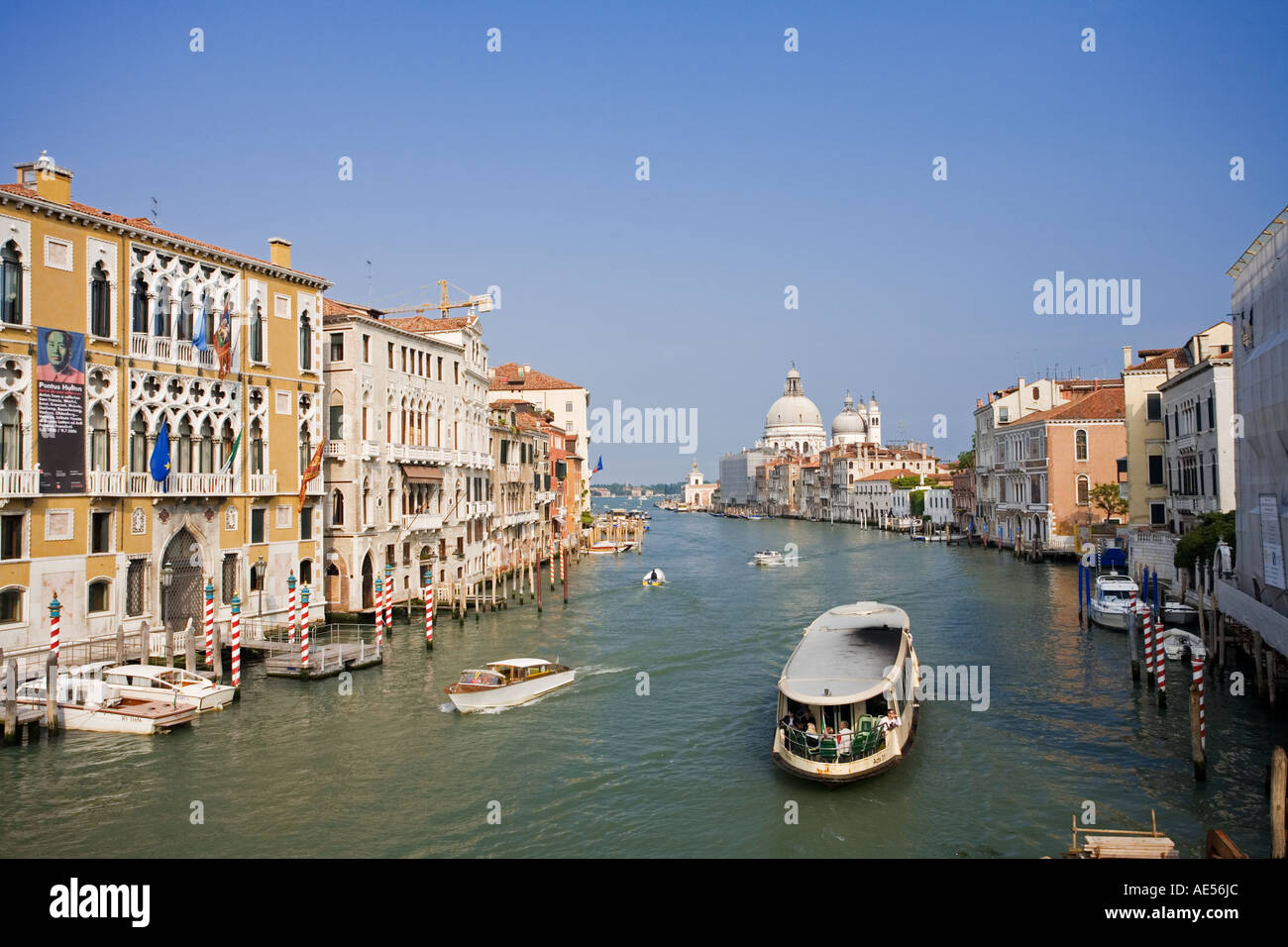 The Grand Canal showing Water Taxis and Water buses and with typical Venusian architecture in Venice Italy Stock Photo