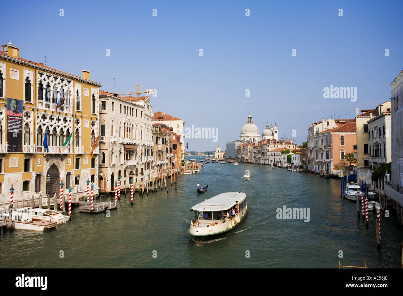 The Grand Canal showing one the many Water Buses and typical Venusian architecture in Venice Italy Stock Photo