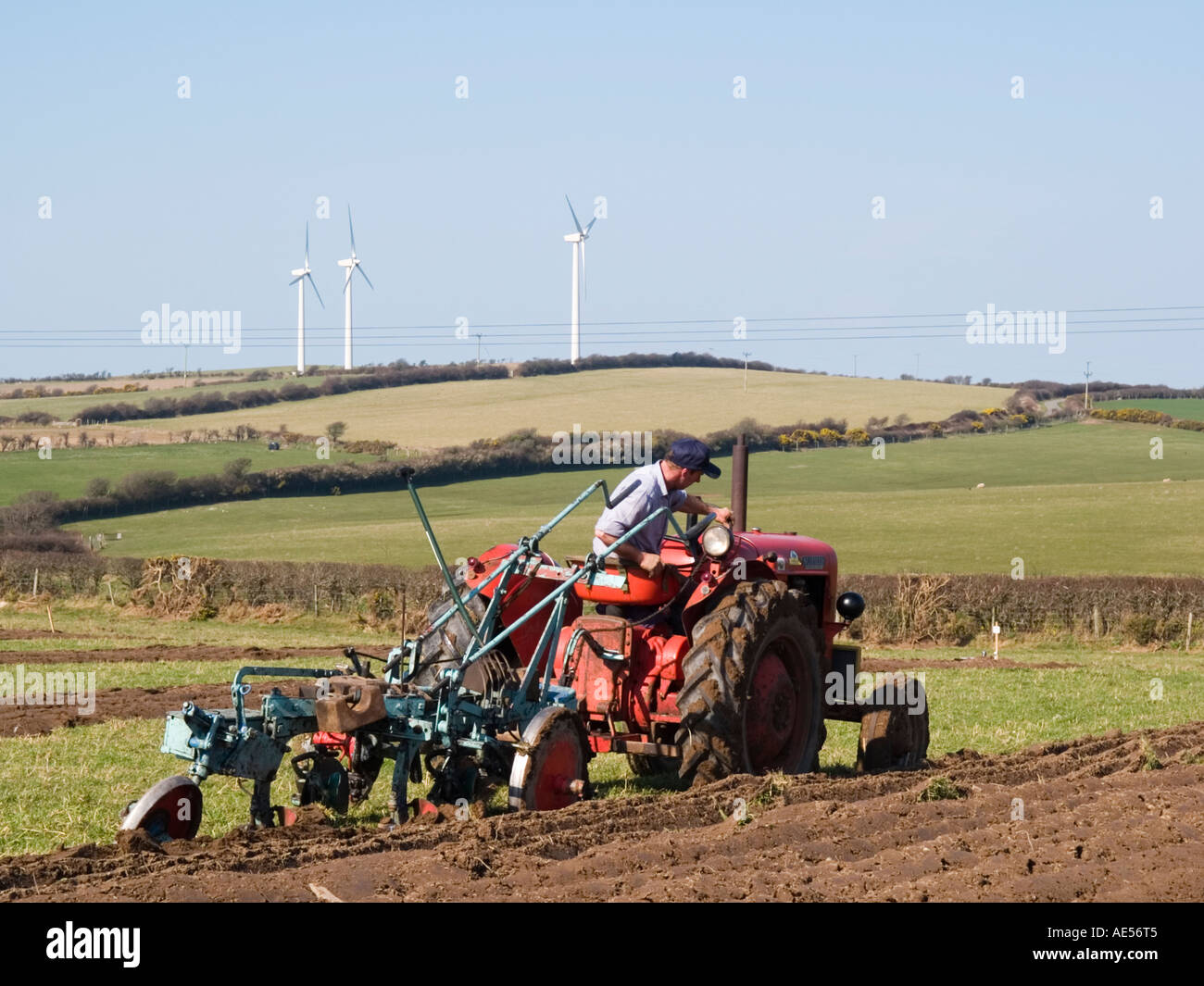Driver on old red Nufield tractor at Anglesey Vintage Ploughing match
