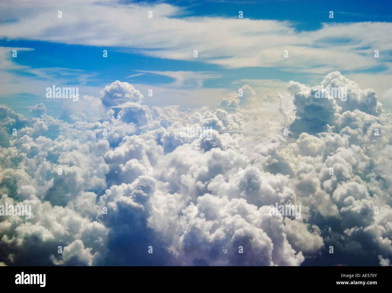Cumulus clouds with stratus at 30,000 feet above sea level. Stock Photo