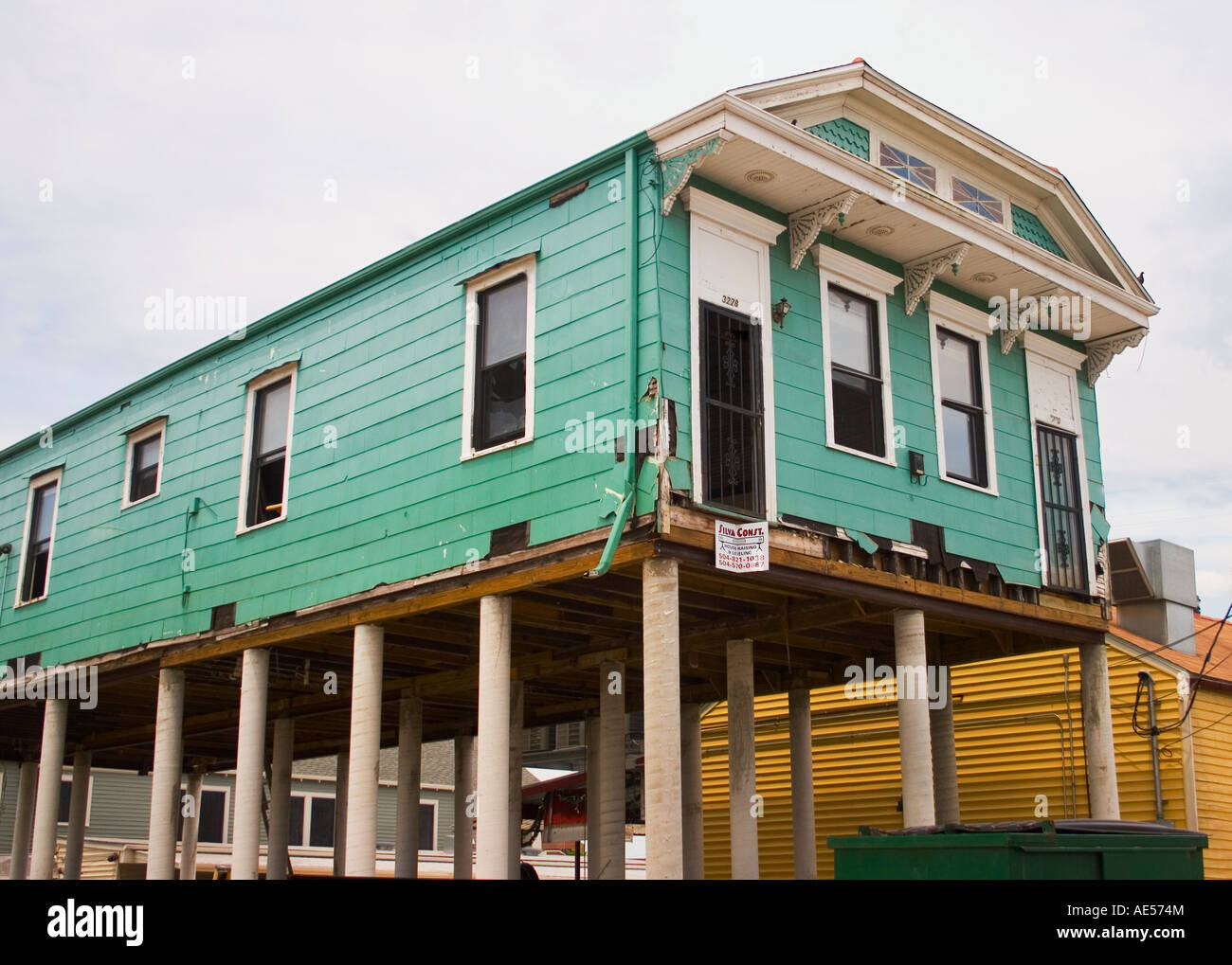 New Orleans shotgun cottage raised on fifteen foot piers two years after hurricane Katrina.  August, 2007. Stock Photo