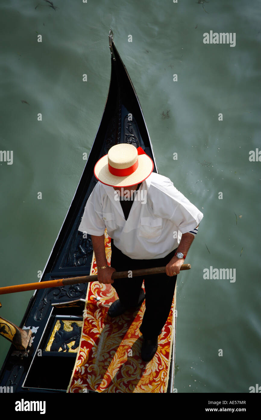 Gondolier steers gondola on the Grand Canal, Venice, Italy Stock Photo