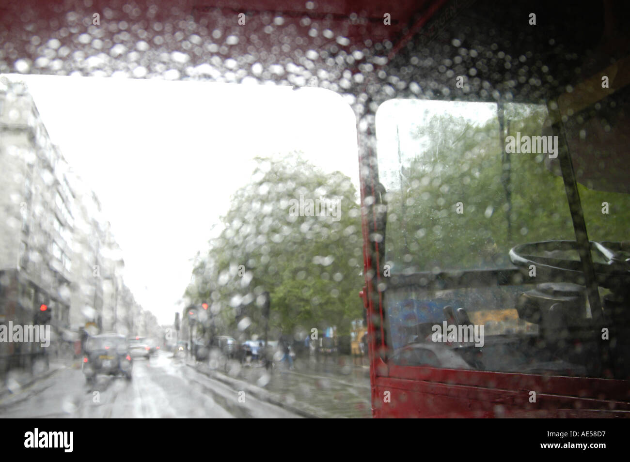 Red Routmaster double decker bus in the rain, London England UK Stock Photo