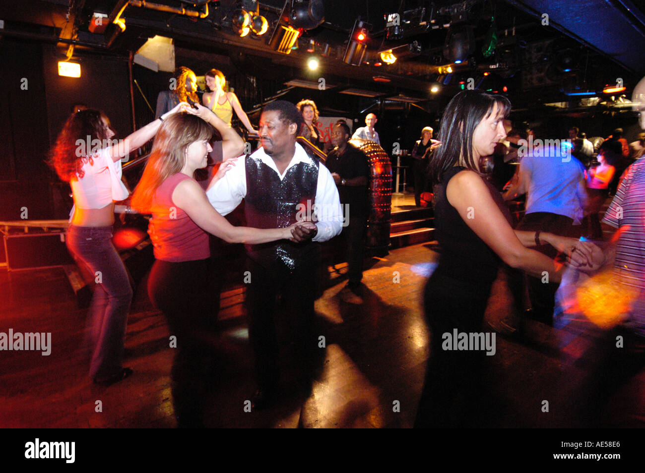 Couples salsa dancing in nightclub London England UK Stock Photo