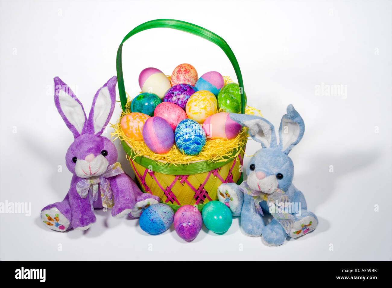 Straw Easter basket filled with eggs of different colors and patterns