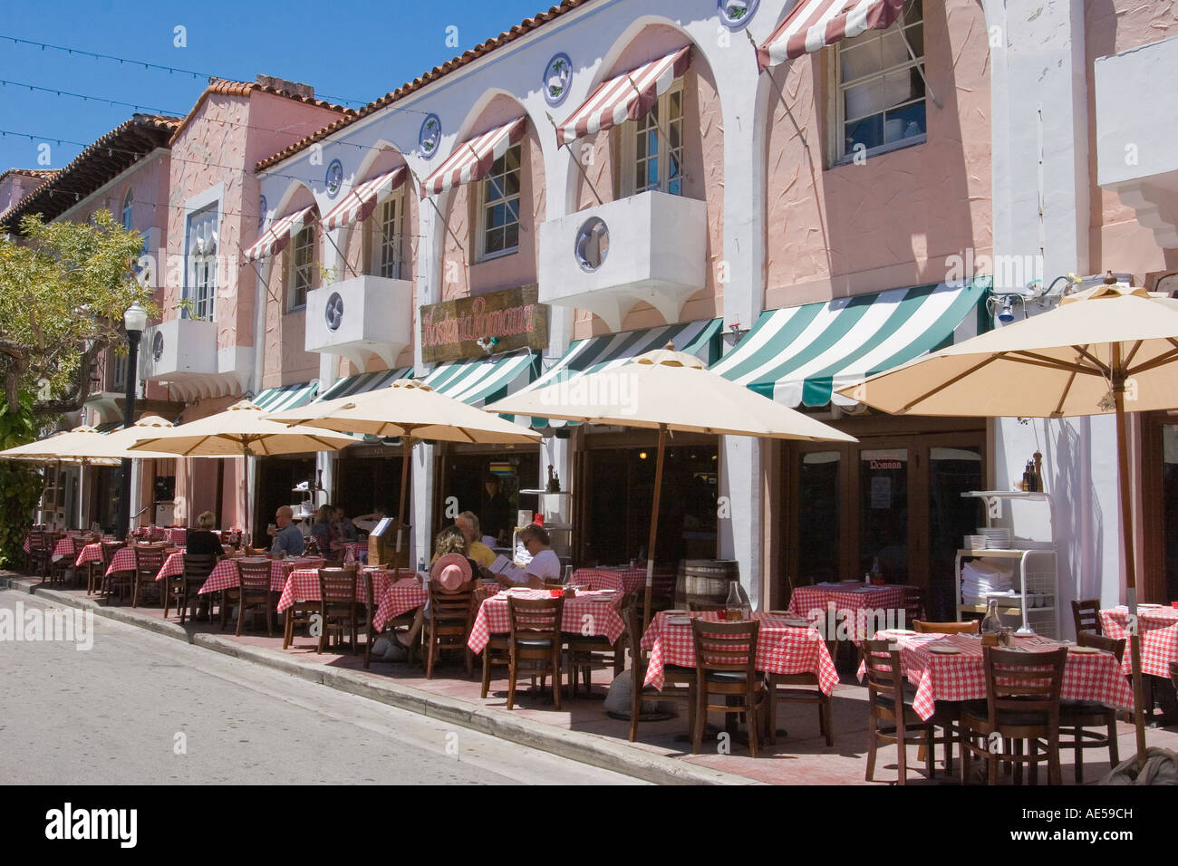 Customers dining at outdoor tables of Italian restaurant on Espanola Way in South Beach, Miami, Florida Stock Photo