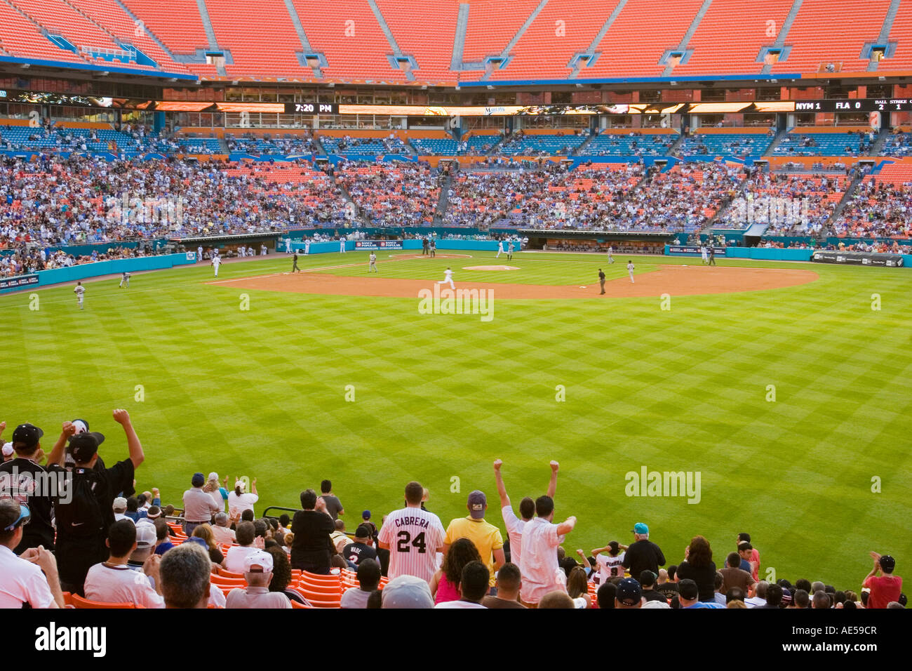 Crowd in the outfield stands at Dolphin Stadium standing and cheering their team Stock Photo
