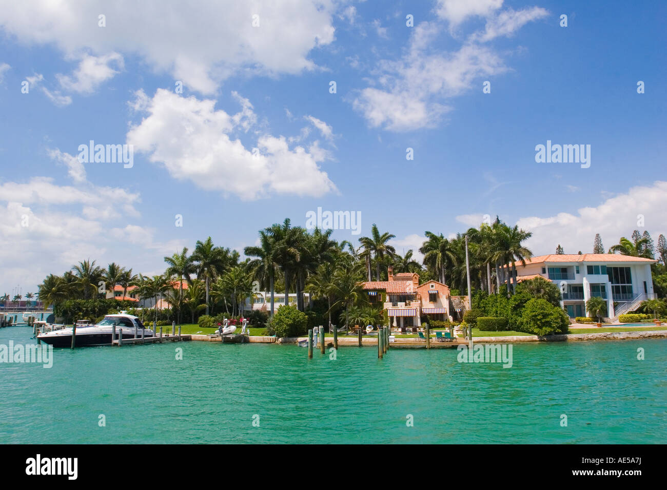 Expensive houses along the waterfront of Palm Island one with a yacht