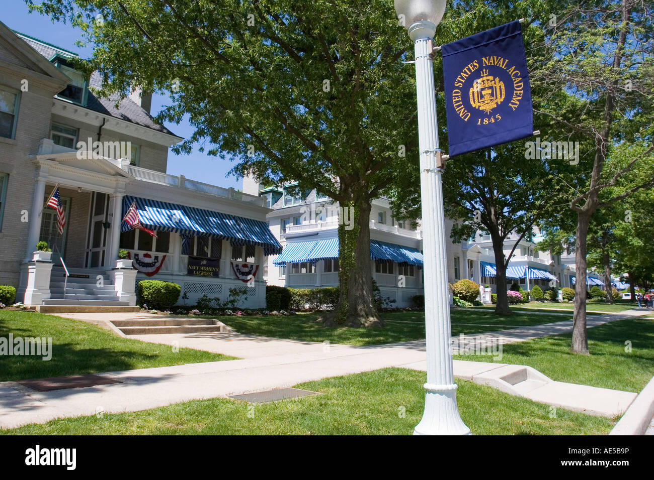 Row of officer houses on the United States Naval Academy campus with a USNA banner in Annapolis Maryland Stock Photo