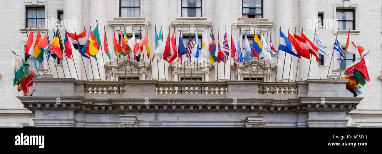 Flags from many nations on classic style architecture building Fairmont hotel San Francisco California Stock Photo