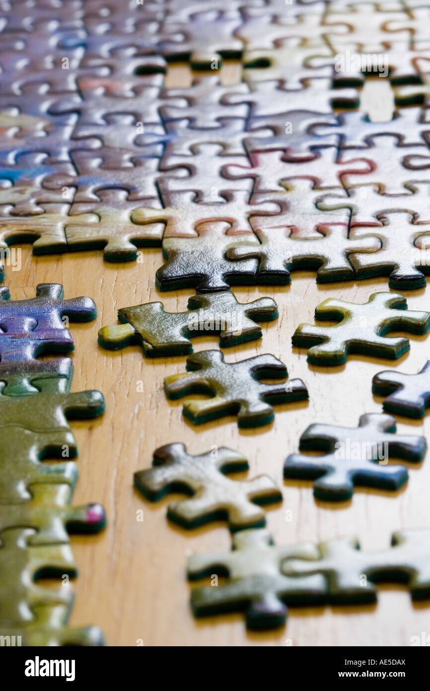 Pieces of jigsaw puzzle under construction Stock Photo Alamy