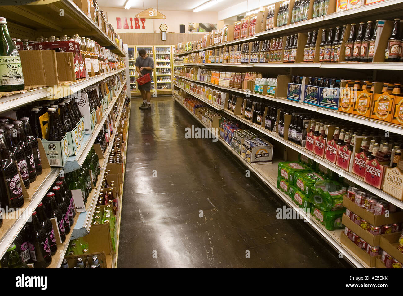 Man shopping for soda and beer in beverage store aisle with large selection  Stock Photo - Alamy